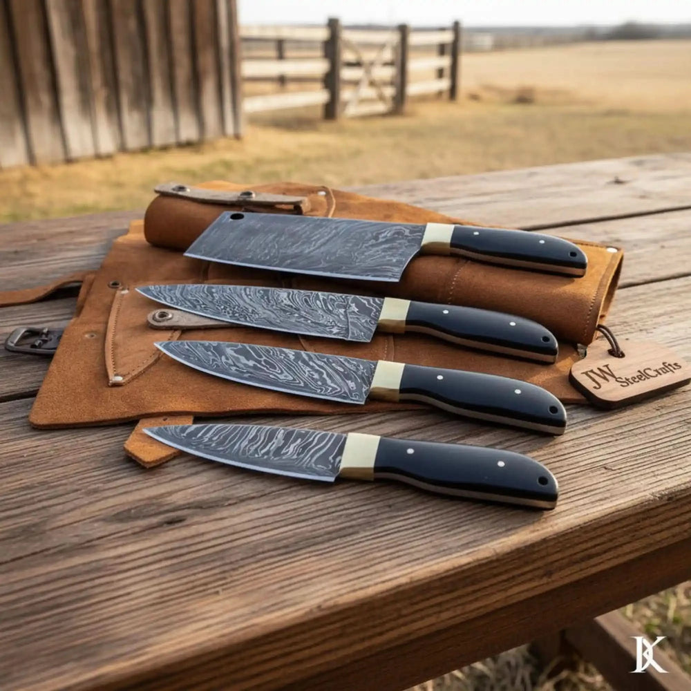 Black handle Damascus knives arranged on a leather roll over a rustic wooden table

