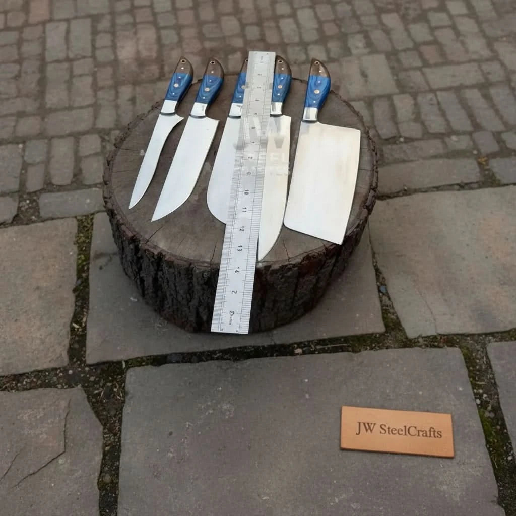 Full size reference view of handmade Damascus chef knives on outdoor tree stump