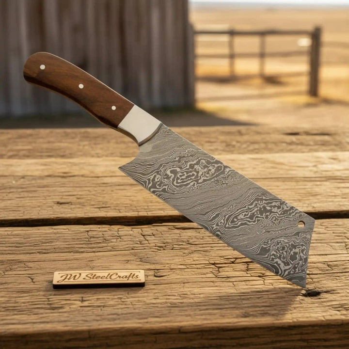 Wood handle Damascus cleaver with layered steel blade and smooth ergonomic grip.