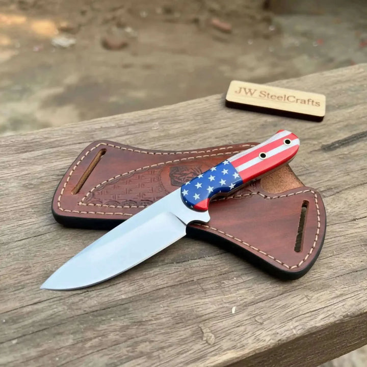 Damascus Steel Chef Knife With American Flag Knife With American Flag Handle In Leather Sheath On Wooden Surface
