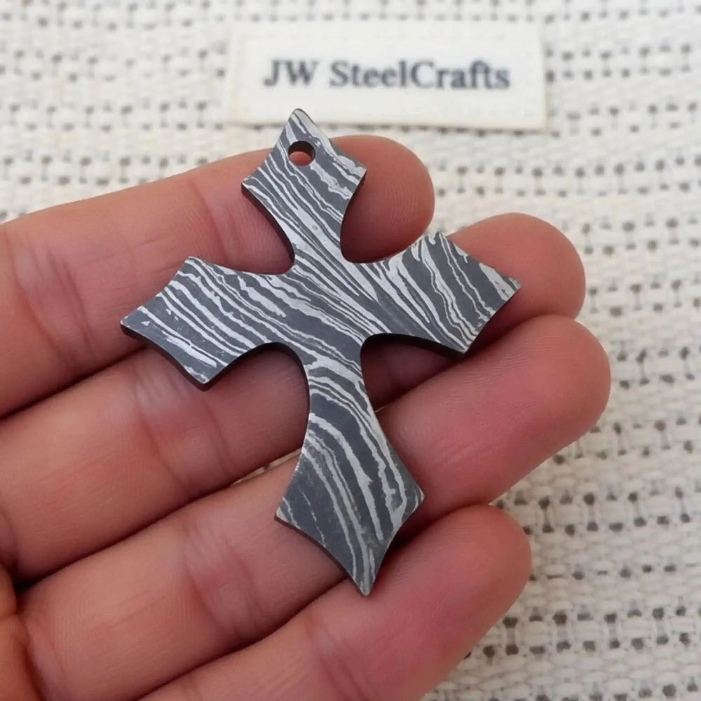Damascus Steel Christian Cross Pendant Locket Metallic Cross Pendant Held In A Hand
