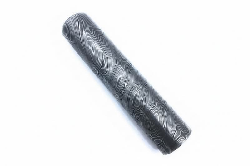Polished round Damascus steel bar with layered wave pattern used for handmade knife making and custom metal craft projects