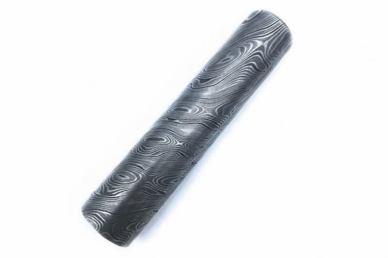 Round Damascus steel stock material with layered swirl pattern finish for custom knife making and metalworking applications