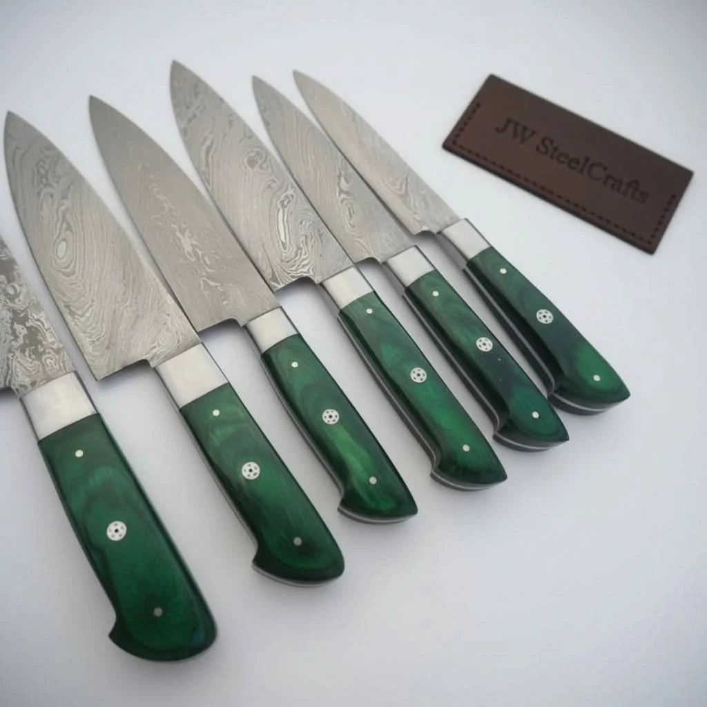 Premium green woodgrain chef knife collection arranged tightly to highlight handle contours and blade transitions.
