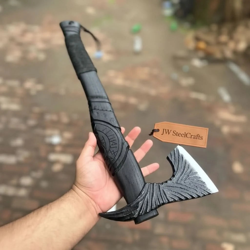 Cedarveil-inspired Viking combat tool with engraved black blade and compact survival setup beside camping gear.