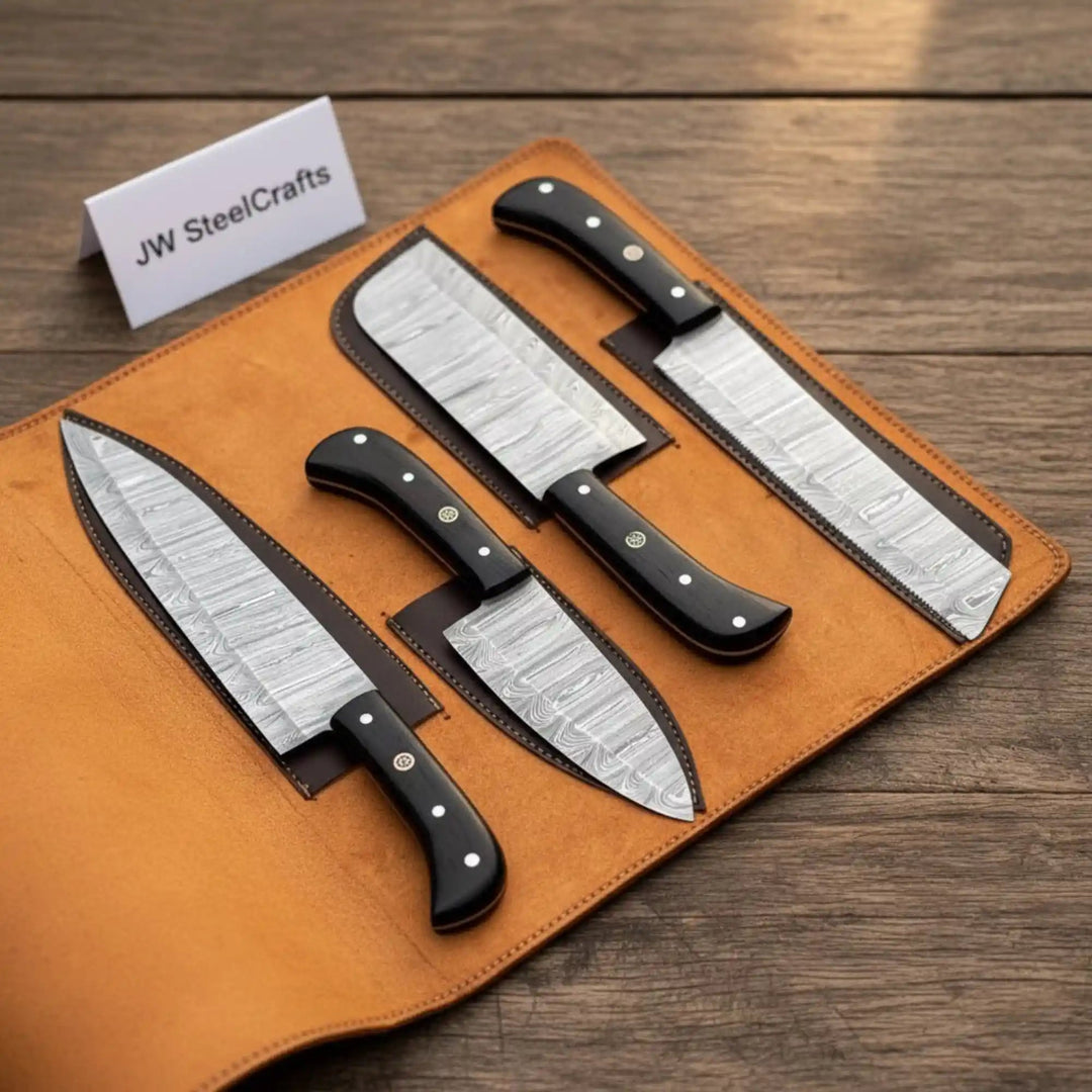 Stainless steel chef knives with ebony wood handles displayed in leather roll organizer