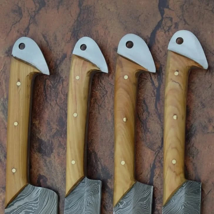 High end Damascus chef blades featuring modern rustic styling and handcrafted layered steel construction.