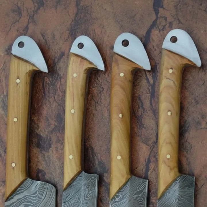 High end Damascus chef blades featuring modern rustic styling and handcrafted layered steel construction.
