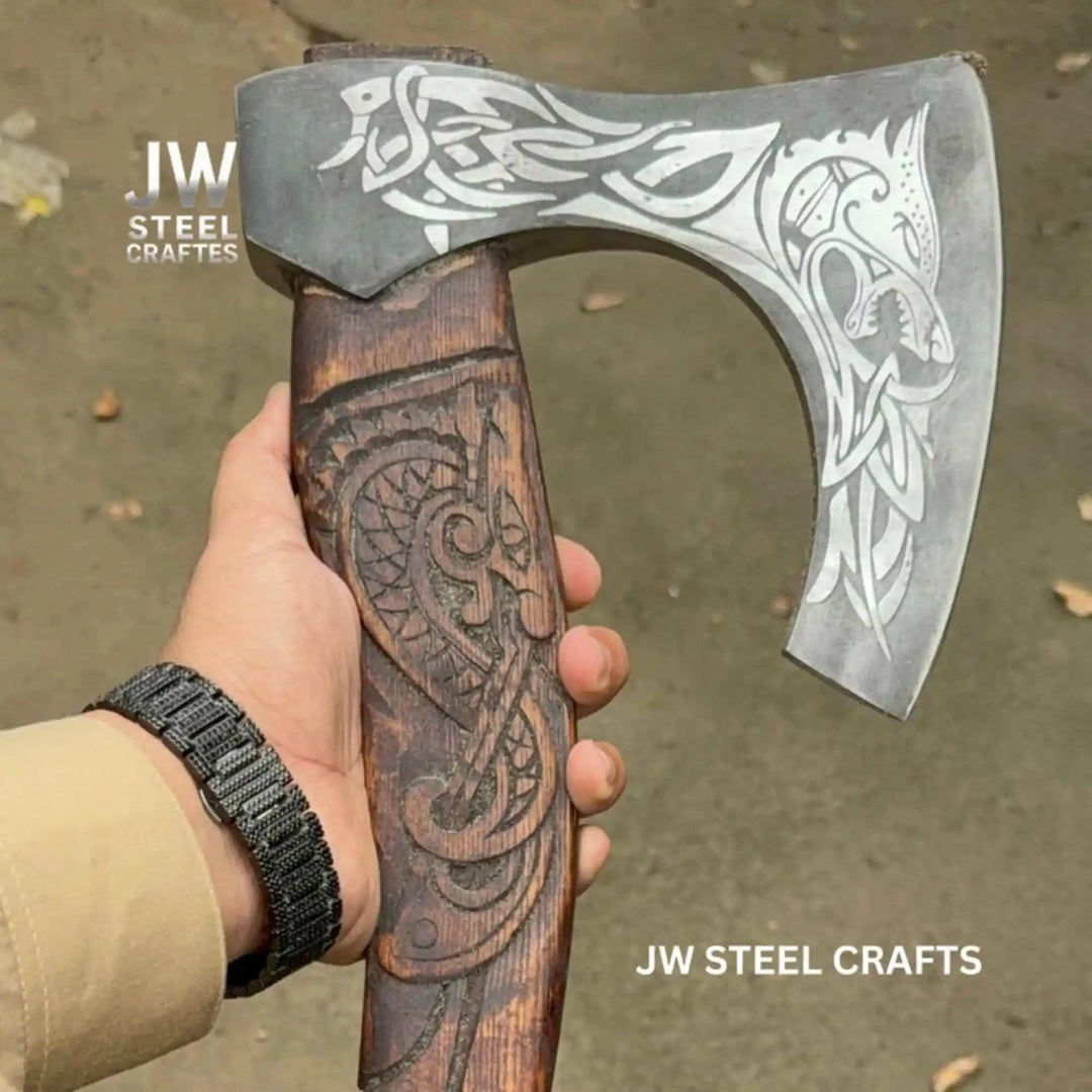 Crowspire-inspired Viking combat hatchet showcasing intricate raven carvings and decorative wood handle patterns.
