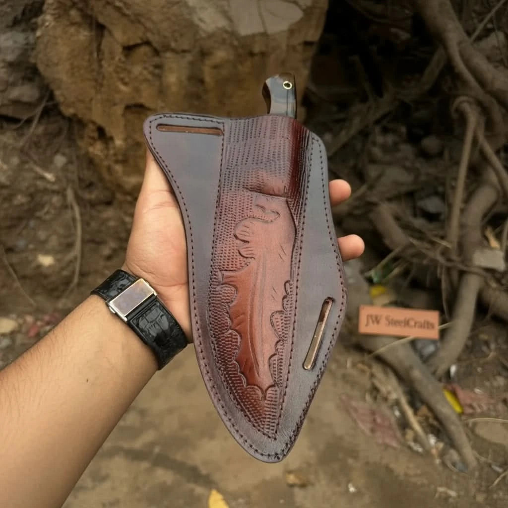 Stitched custom sheath with textured brown leather and a dark handle knife partially inserted.