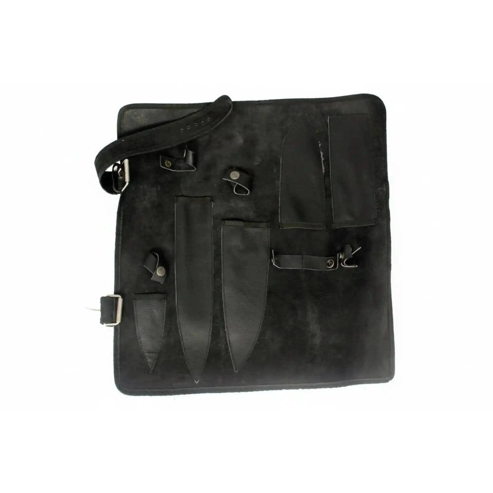 Compact knife roll up case made from dark suede leather for transporting kitchen tools.
