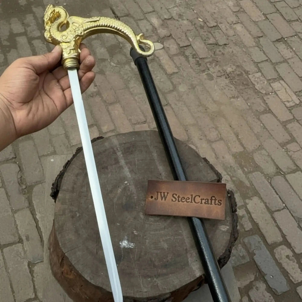 A dragon head walking cane with the inner blade removed beside the black cane shaft.