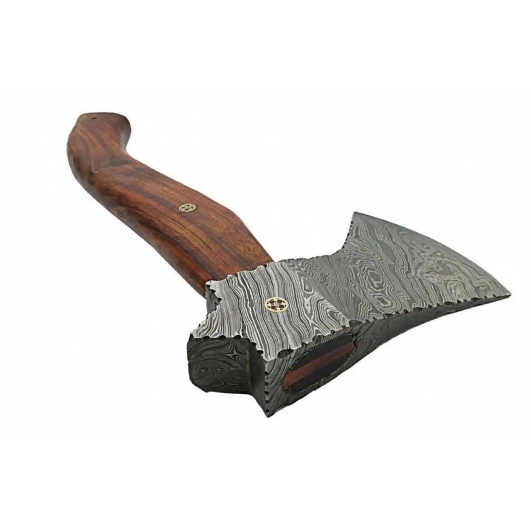 Closeup of mosaic pin and Damascus steel pattern on hand forged camp axe head