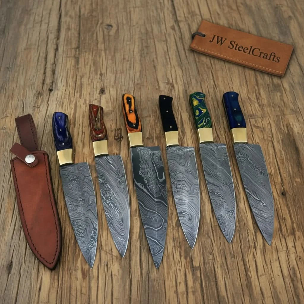 Vibrant handle Damascus cutlery set arranged with a brown handmade leather sheath