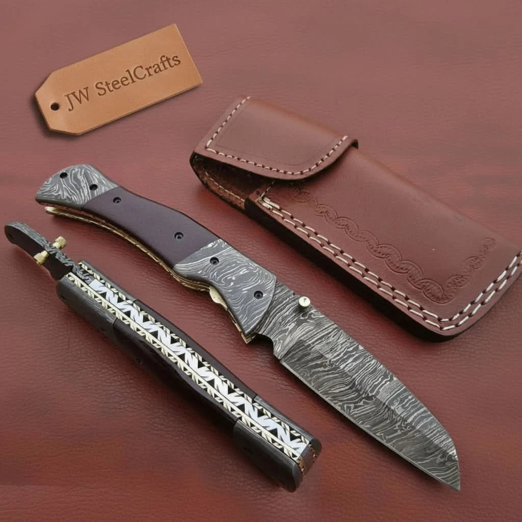     Custom Damascus steel folding knife featuring decorative handle details and secure locking mechanism