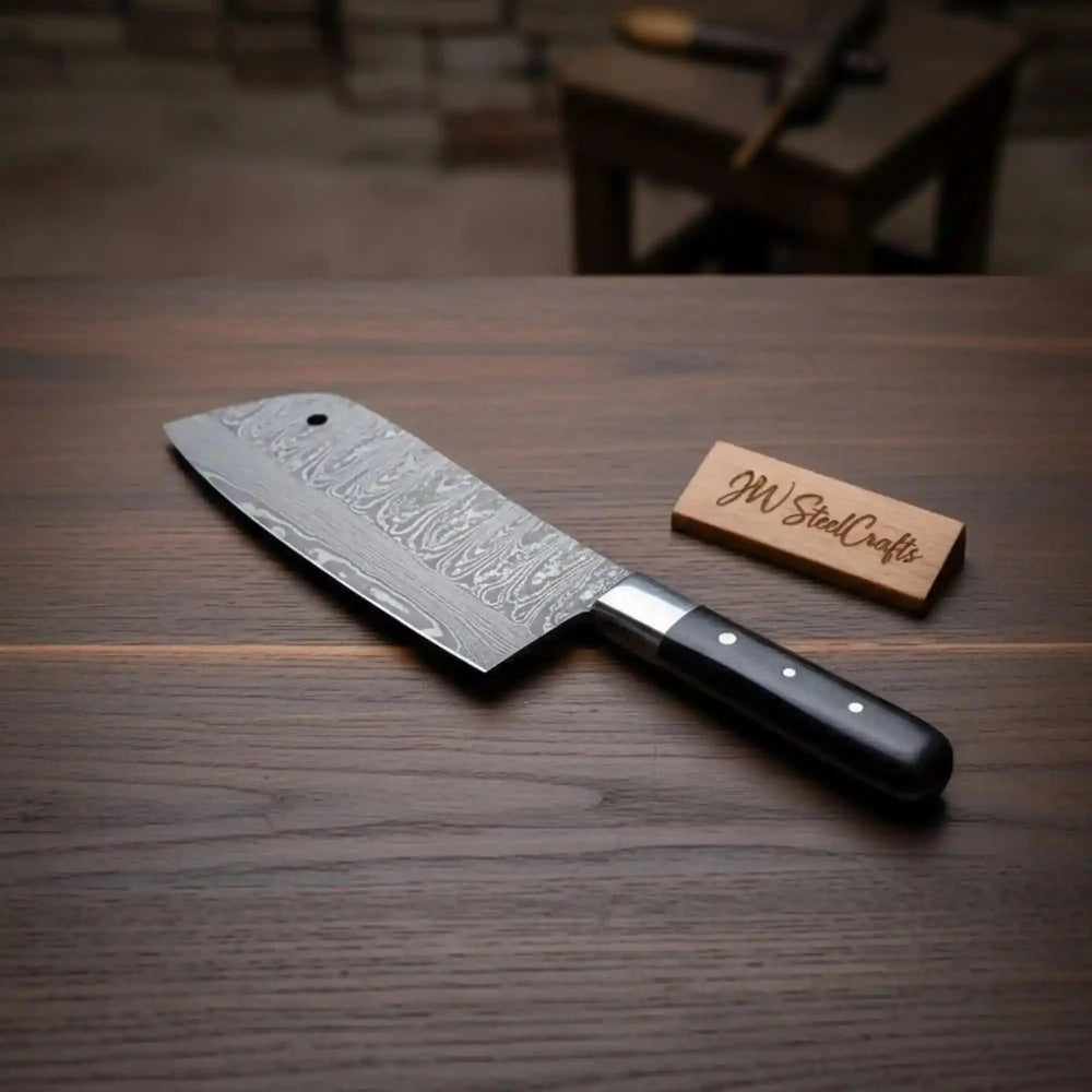Layered steel chopper knife display showing blade pattern and polished cutting edge