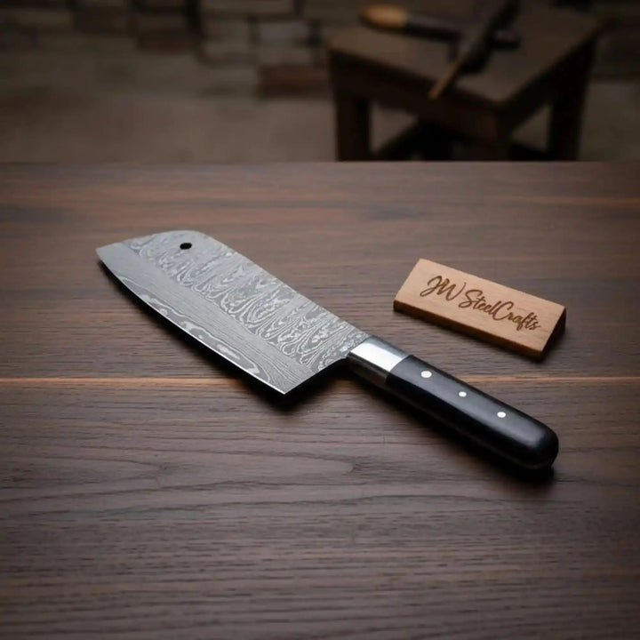 Layered steel chopper knife display showing blade pattern and polished cutting edge