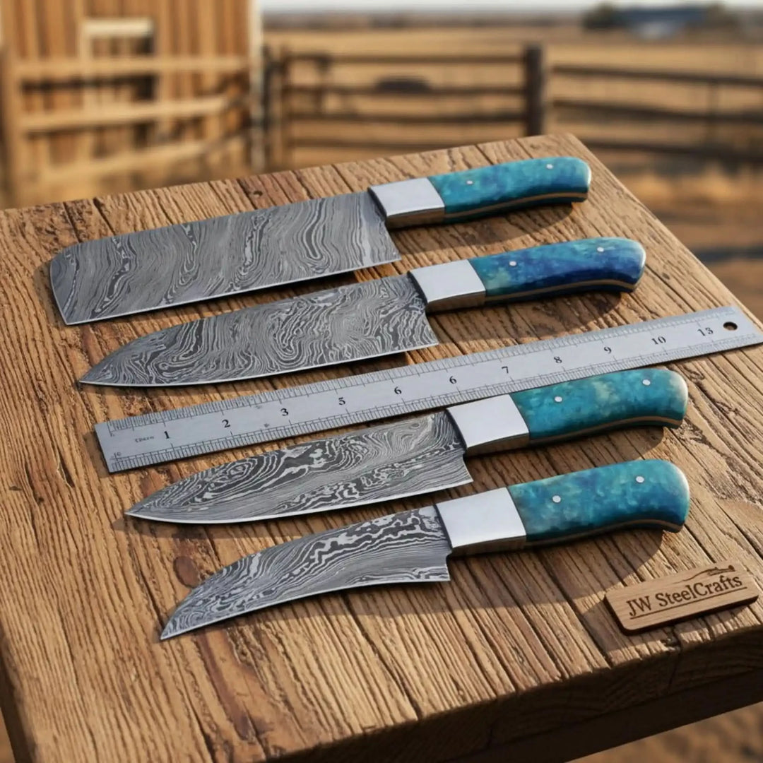 Turquoise handle Damascus cutlery set arranged beside a metal ruler on wood
