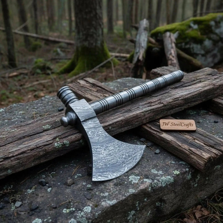 Ember-inspired Viking rustic tool displaying premium Damascus craftsmanship and outdoor forest presentation.
