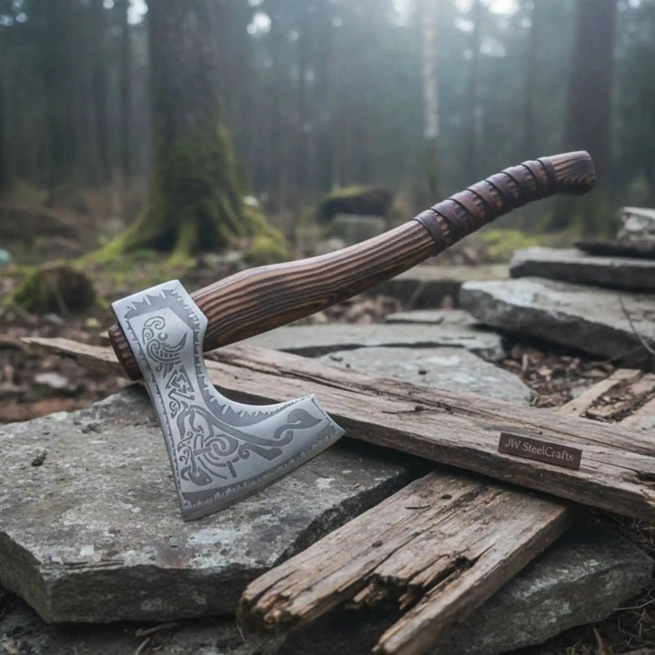 Horizon-inspired Nordic engraved axe displaying polished steel blade patterns and wrapped wood textures.