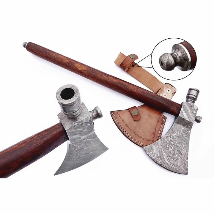     Hunter-themed Viking pipe weapon displaying engraved Damascus blade and leather carrying sheath details.