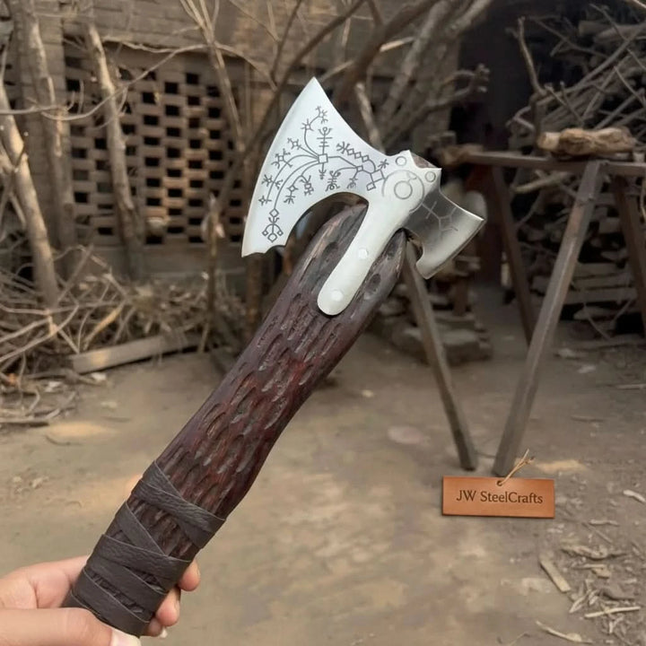 Harbor-themed Nordic engraved hatchet with decorative rune symbols and carved wooden shaft.