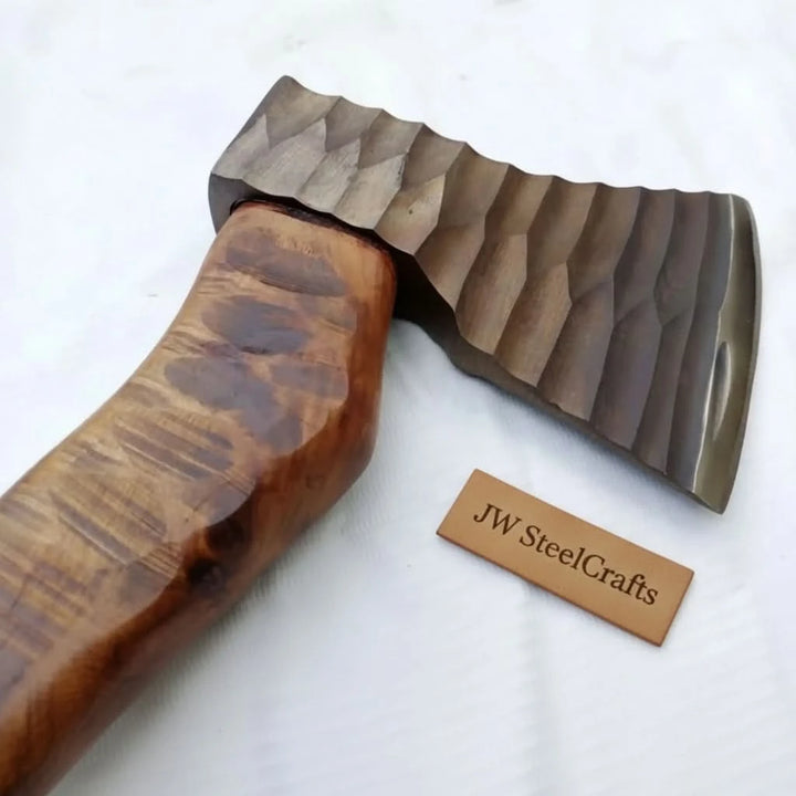 Highthorn-themed Nordic battle hatchet with decorative forged steel patterns and handcrafted curved wooden grip.