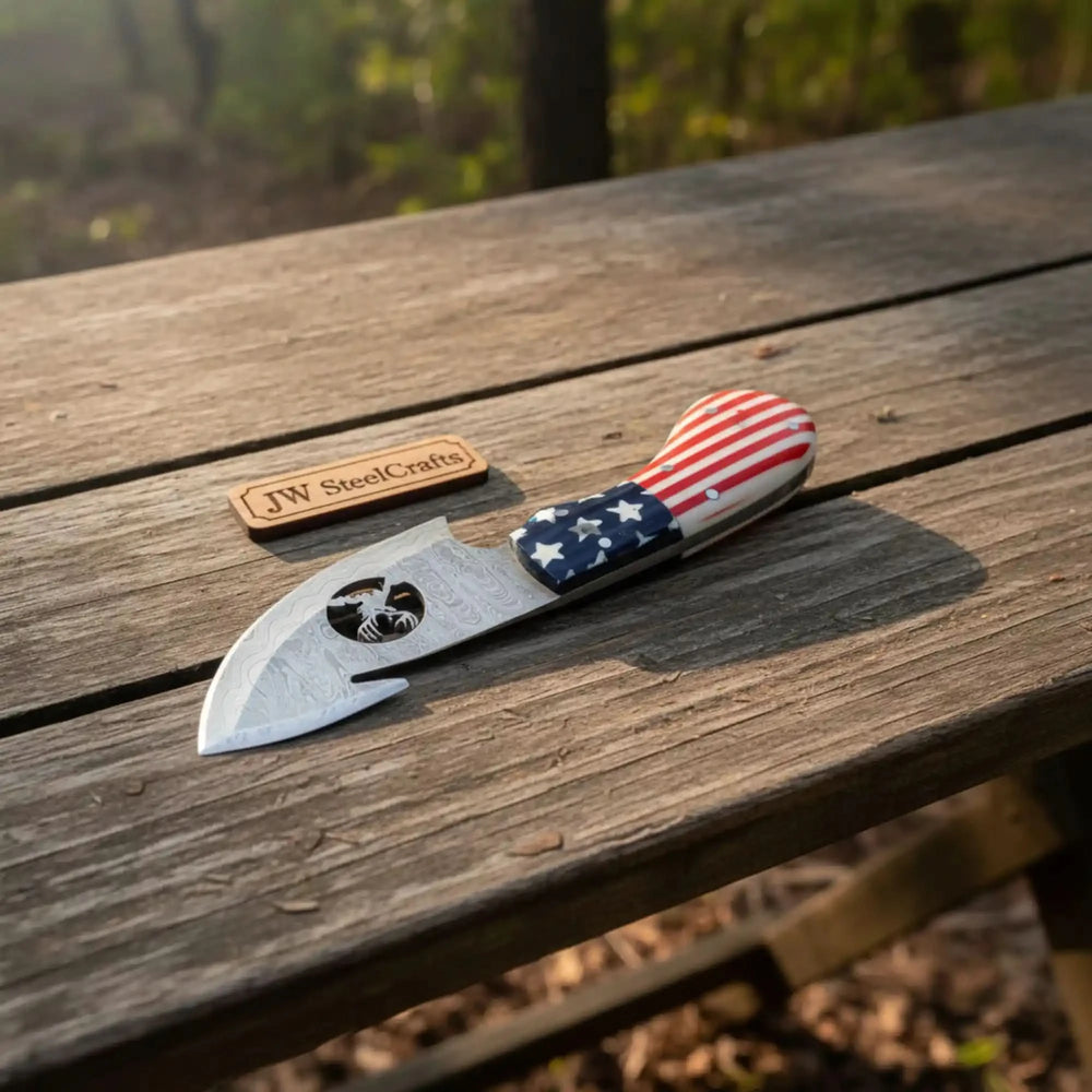 Knife with American flag handle on a wooden surface