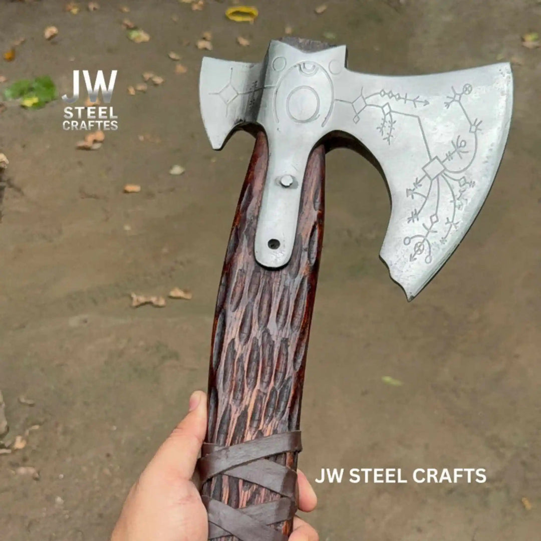 Damascus double-bit Viking axe side profile showing Norse rune engravings on both sides of the steel head