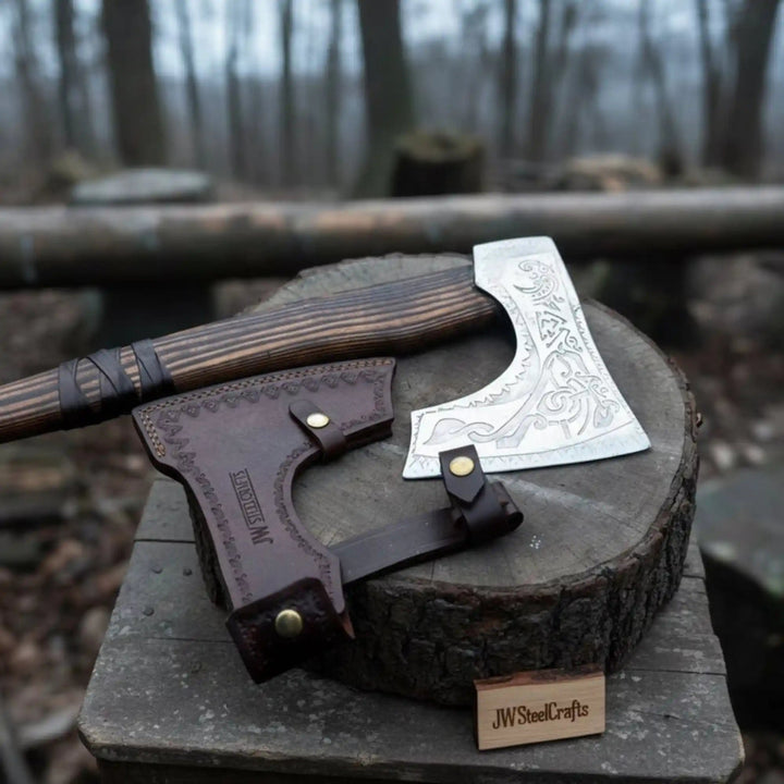 JW SteelCrafts carbon steel Viking axe with carved ash wood handle and protective leather sheath