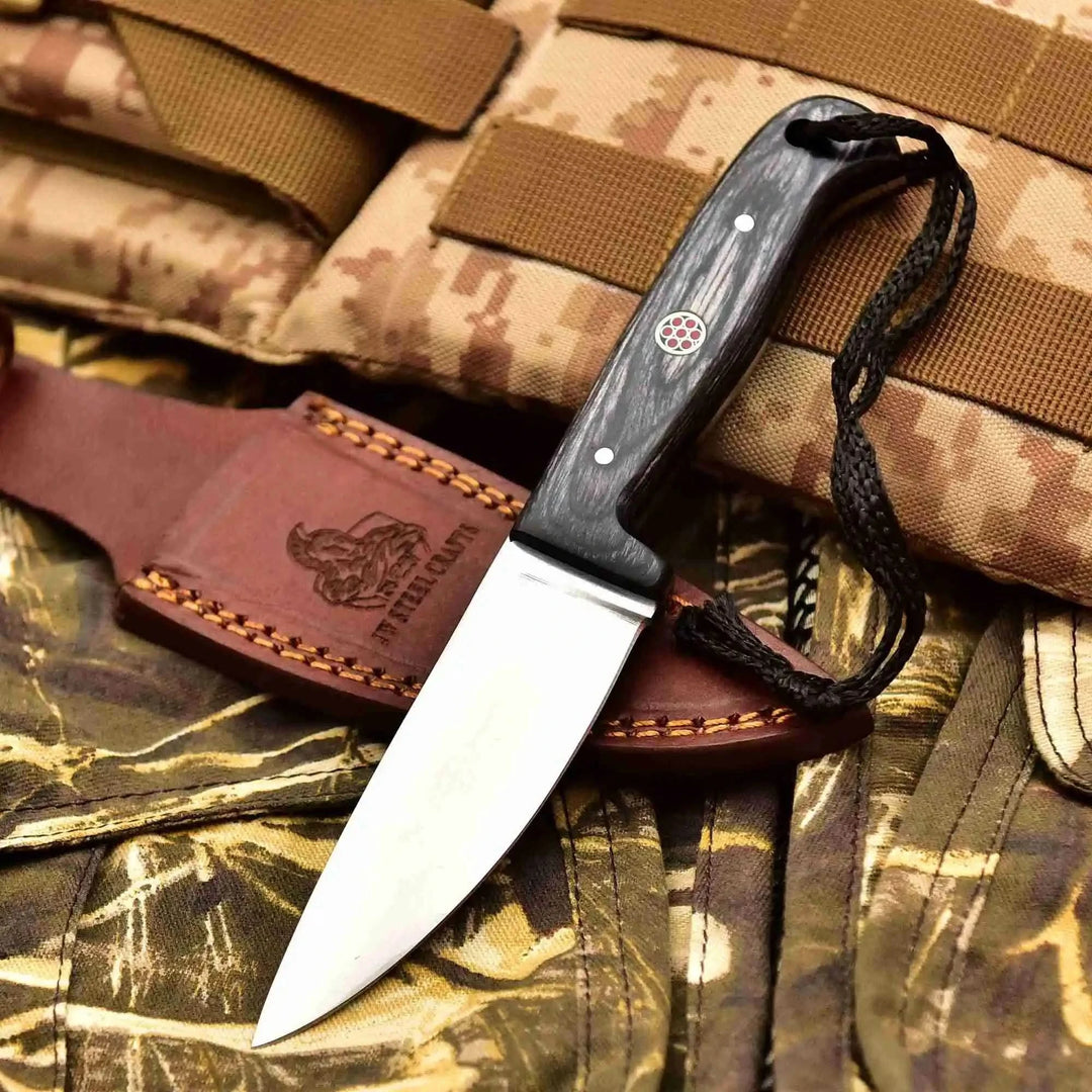 Polished blade knife set with leather holsters, colored handle scales, decorative pins, and outdoor tactical display.