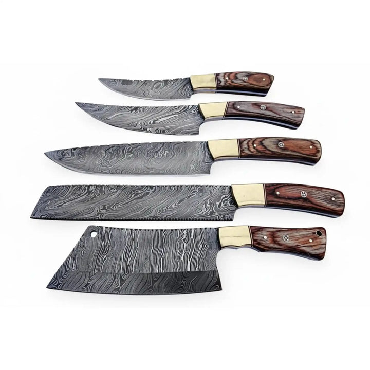 High end kitchen cutlery collection featuring cleaver style blade and precision slicing knives with brass bolster accents.