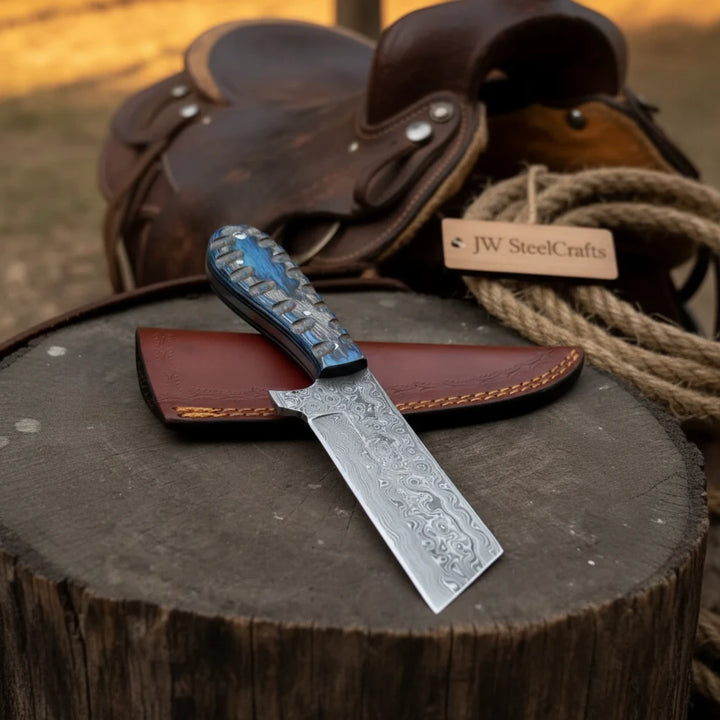 Handmade Damascus Steel Cowboy Bull Cutter Knife With Brown Sheath On A Wooden Stump