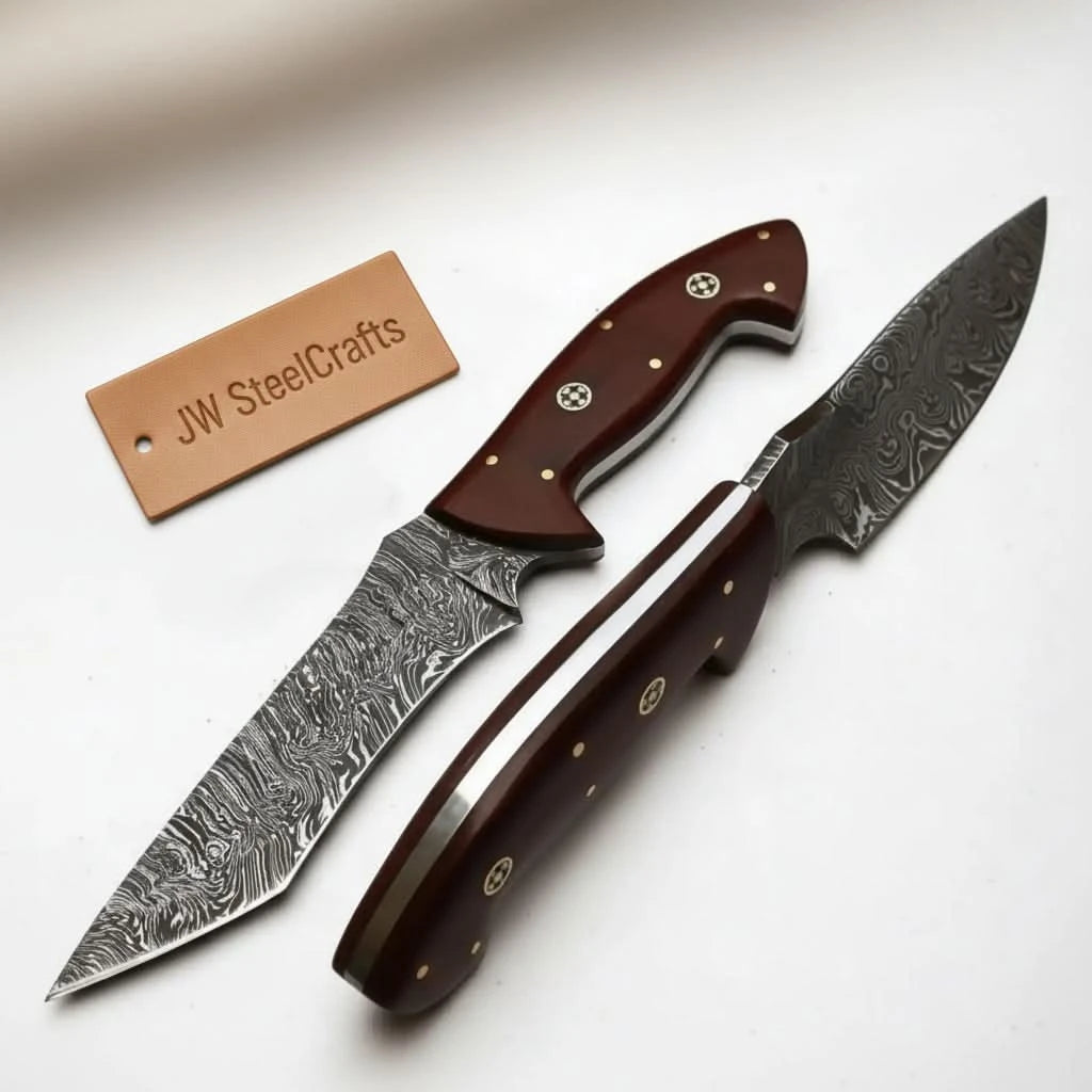 Artisan Damascus hunting knives on white background with brown wooden handles, decorative pins, and layered steel blades