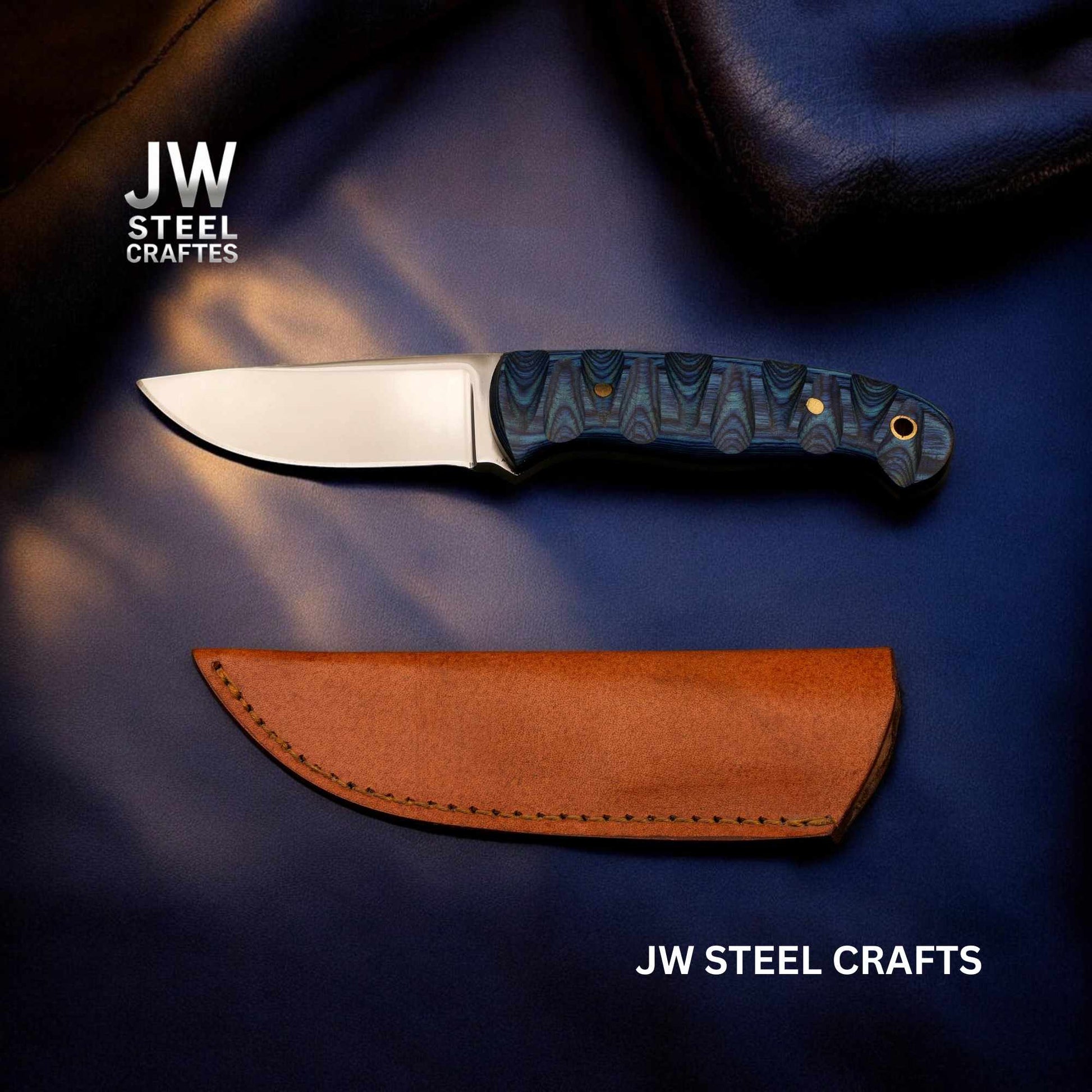 Knife with blue handle and brown leather sheath on a dark background with 'JW Steel Crafts' branding.