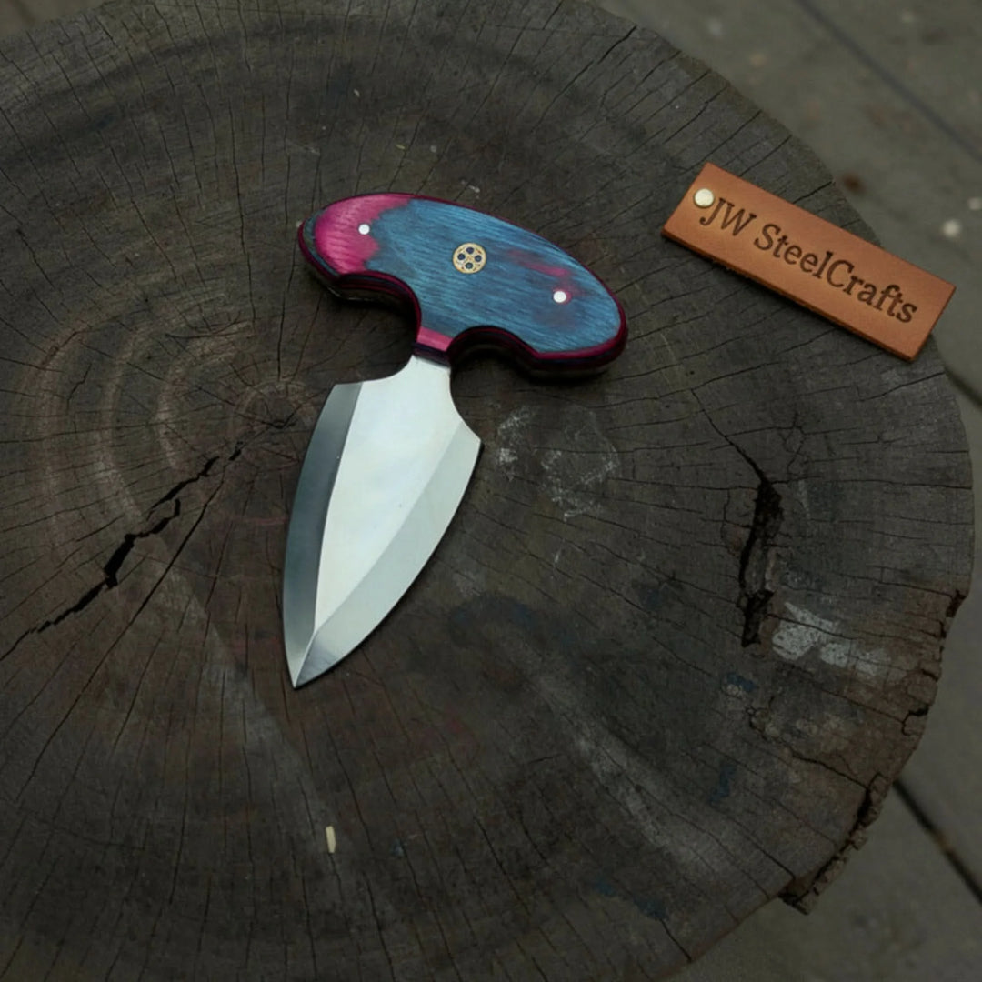 Handmade Push Dagger  With A Wooden Handle On A Wooden Surface