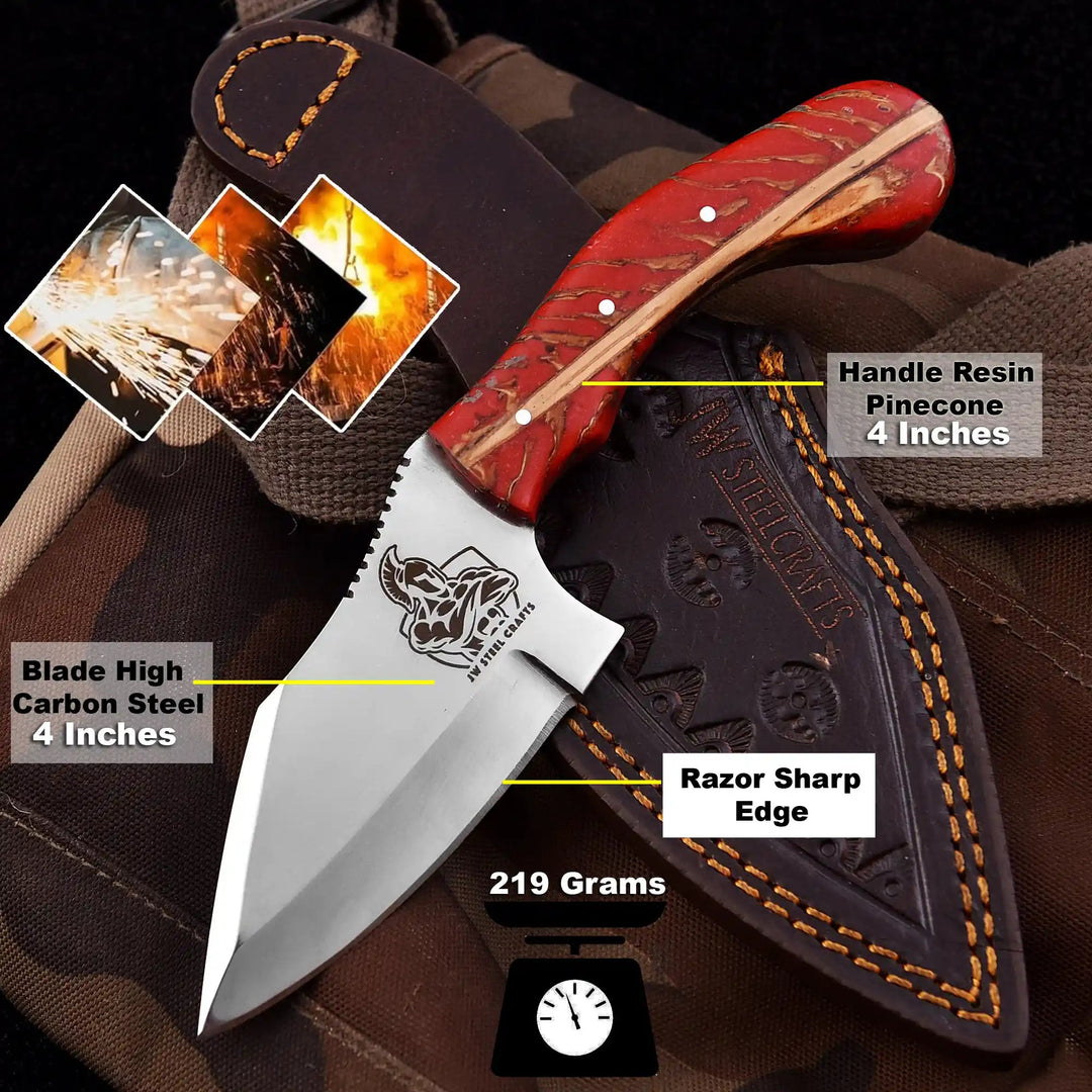 Razor sharp edge fixed blade knife with 4 inch blade, red resin handle, and brown leather sheath on camouflage fabric.