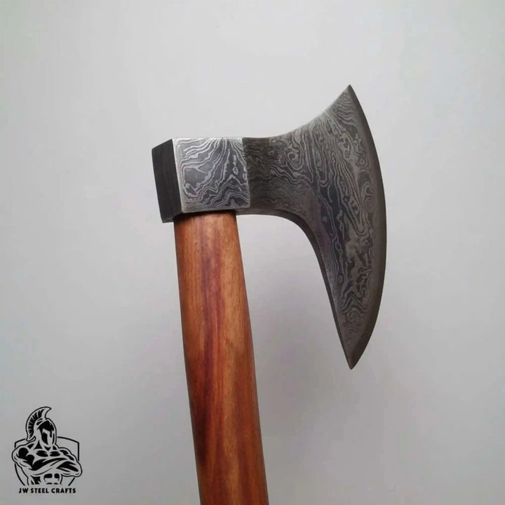 Jadefang-themed Norse battle hatchet displaying artistic patterned blade and handcrafted hardwood handle details.