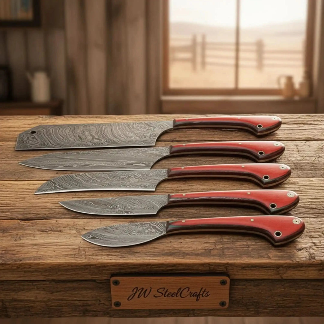 Decorative red handle chef knives with polished steel bolsters and patterned Damascus blades.