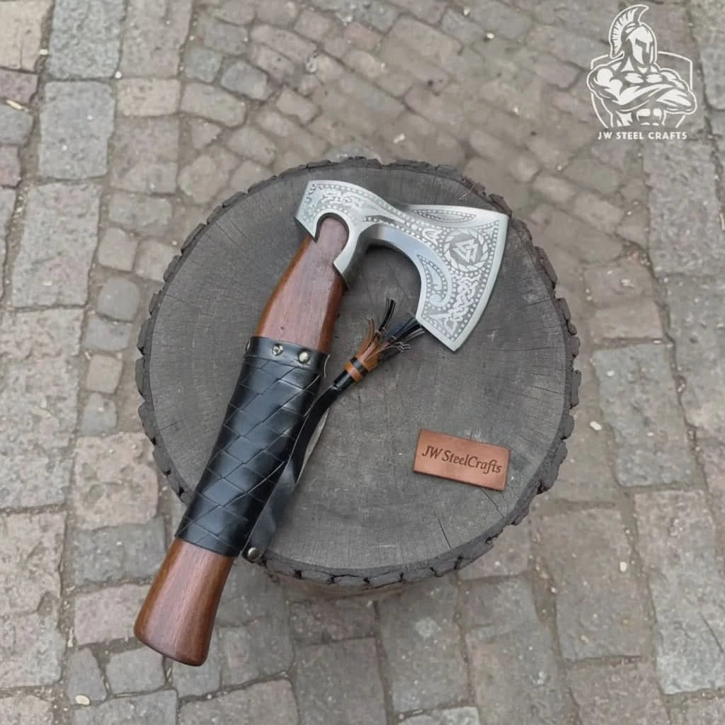 Jaggedthorn-themed Norse outdoor axe displaying rugged black grip and handcrafted leather sheath details.
