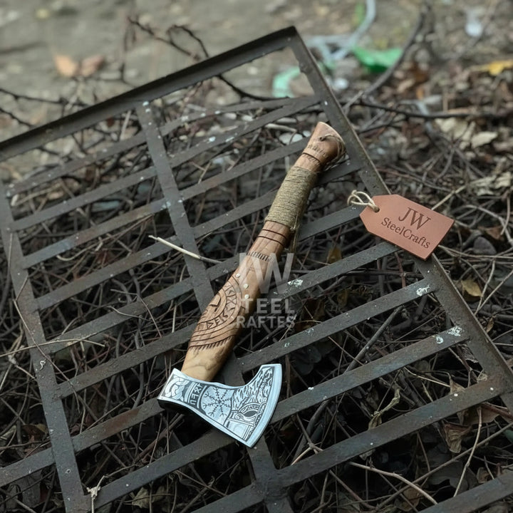 Harbor-themed double-edge Viking axes with decorative steel blade patterns and rustic leather wrapping.
