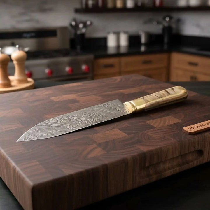 Walnut cutting board utility chef knife scene with JW SteelCrafts tag nearby