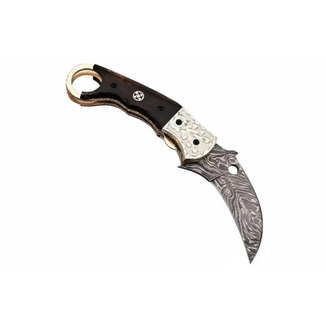     Tactical Damascus karambit folding knife designed with sharp curved blade and secure finger ring grip
