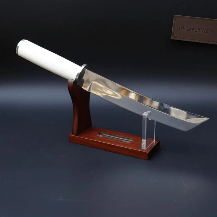 Wooden stand custom short sword display featuring a reflective blade, white grip, and dark studio-style backdrop.