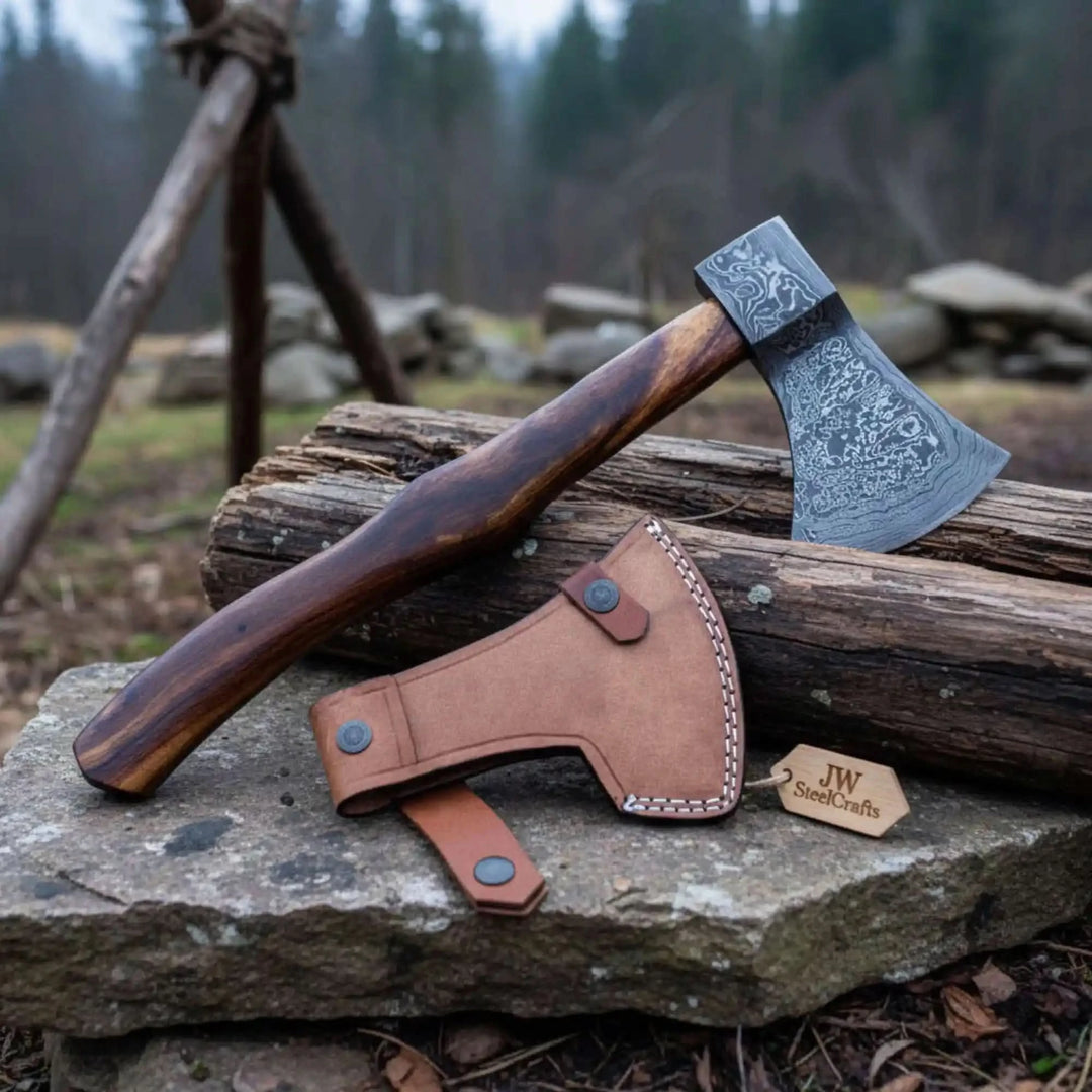 Knight-inspired Viking Damascus hatchet showcasing engraved steel artistry and rugged woodland craftsmanship.