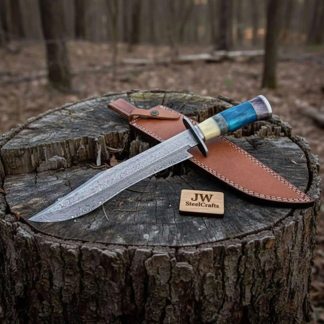     Collector Damascus knife paired with handcrafted leather sheath on weathered tree stump