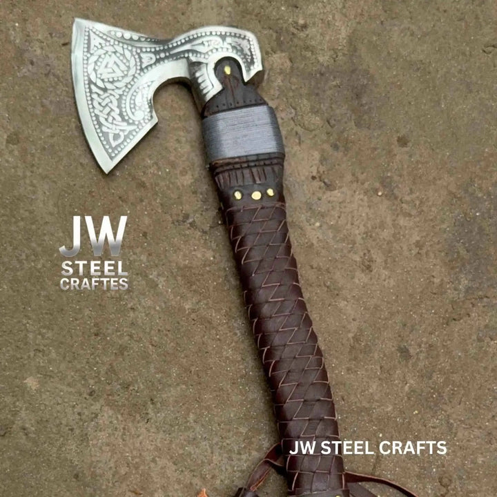 Majestic Viking battle weapon showcasing ornate blade engravings and handcrafted dark leather wrapping.
