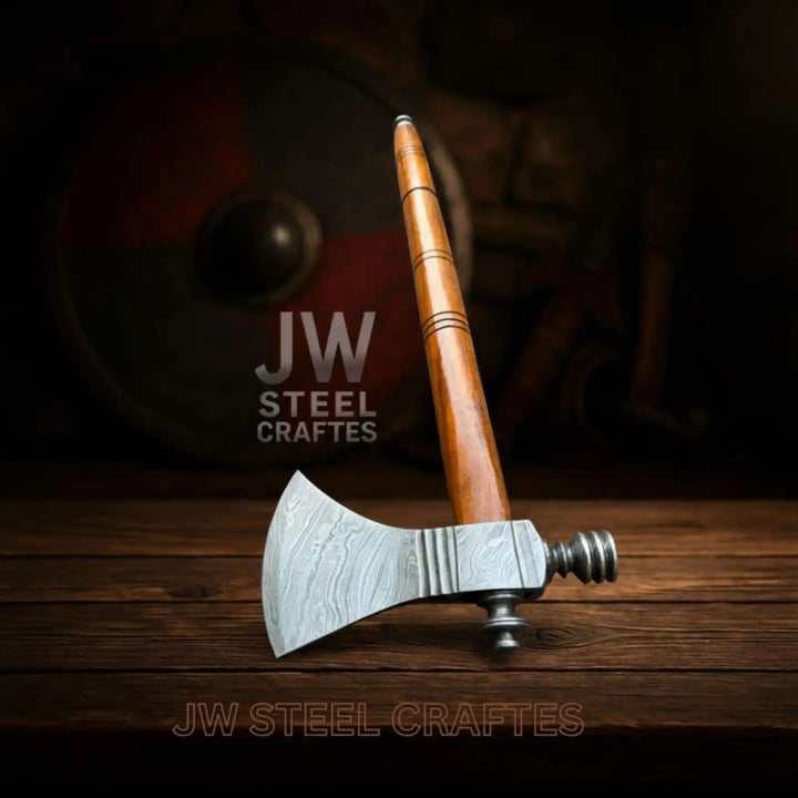 Damascus battle hatchet with forged steel craftsmanship and smooth polished wooden shaft.