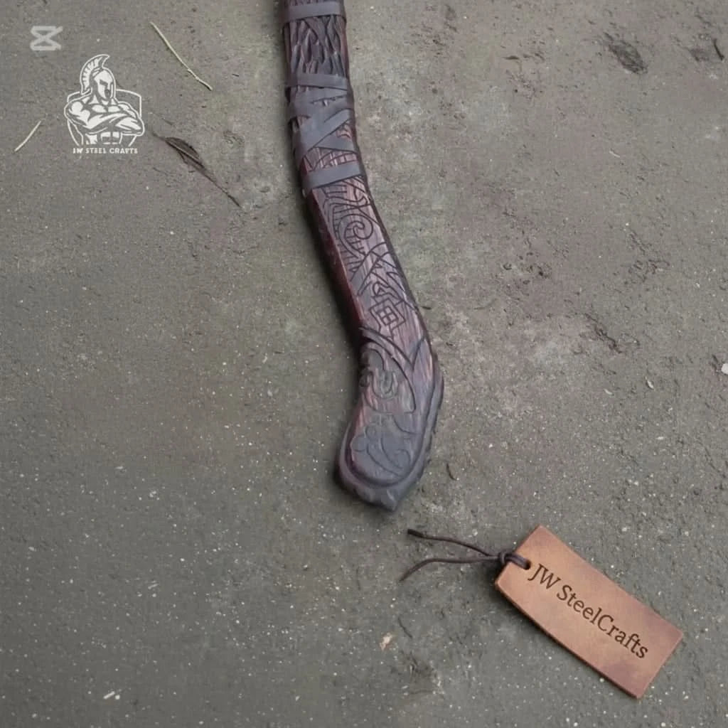 Northern Norse combat axe with decorative rune engravings and handcrafted wooden handle displayed on timber.