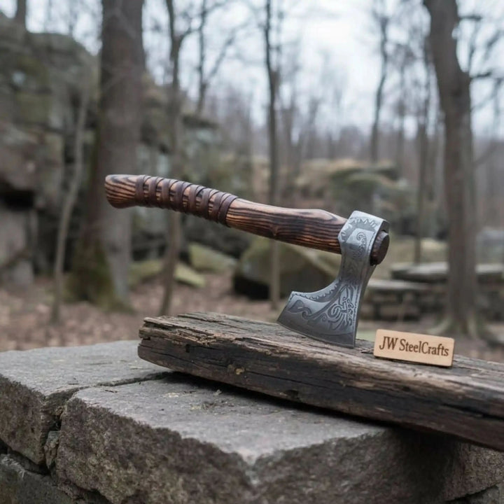 Nebula-inspired Norse combat axe featuring decorative silver engravings and rustic wrapped wooden grip.